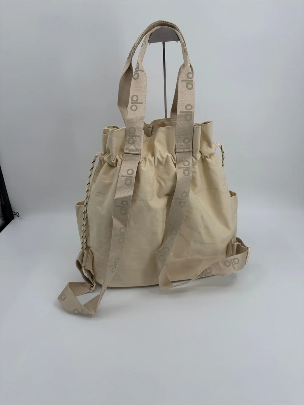 ALO Yoga Cream Drawstring Tote Backpack with Front Pockets Convertible Tote Bag